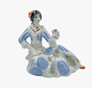 Porcelain figurine of a Gypsy with cards