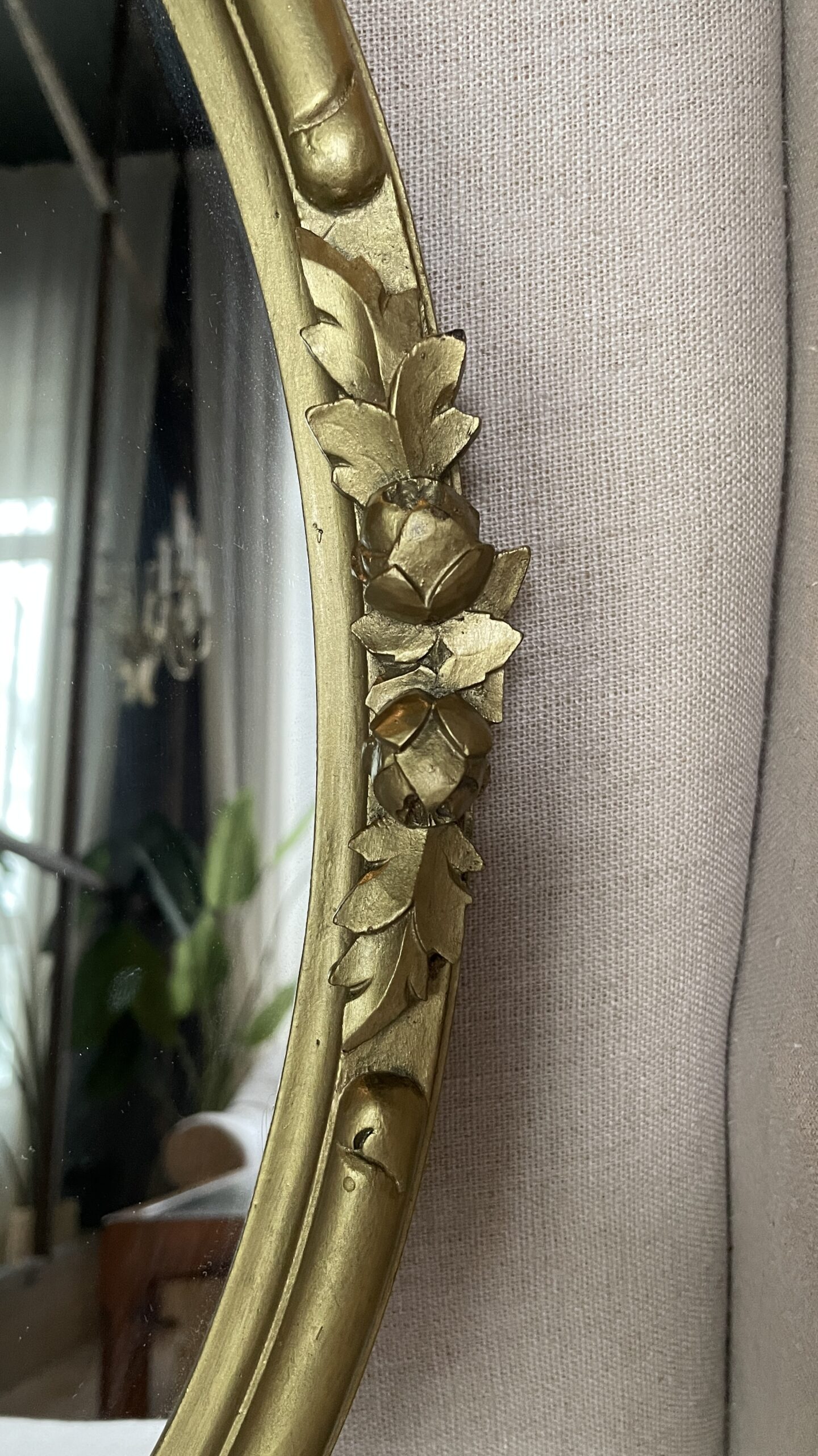 Oval mirror in a carved wooden gold-tone frame-2