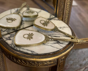 Table set of antique hand mirror and brush