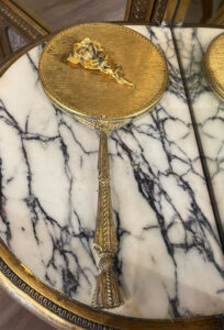 Antique gold-tone hand mirror